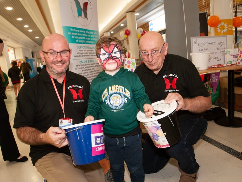 Four years-old Arlo McGuinness donates his pocket money to Paddy McColgan and Joe Carr, ME4 Mental Health Support and Suicide Prevention at Friday's Lisnagelvin event.
