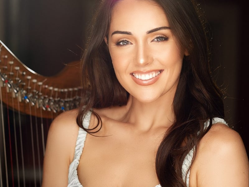 Mayo Rose Kate Heneghan Dia dhaoibh go léir ó Chontae Mhaigh Eo! My name is Kate, and I am a 27 year old harpist, violinist and pianist from Castlebar. I am very honoured to represent my beloved County Mayo in Tralee this year. Since graduating with a Masters in Music Composition from Ulster University, I have worked as a Classical Content Specialist for global music streaming platforms. At the age of 18 I was very fortunate to be able to combine my Undergraduate Degree in Music while touring the world as a musician. I am also very passionate about sharing my love of music with others: I teach music in both genres of Irish traditional and classical music. My family and I formed ‘Westport Scoil Cheoil’ a summer school dedicated to teaching Irish music and promoting Irish culture. As well as teaching music, I regularly host music radio programmes and volunteer as a musician and MC at charity concerts. Sport is another great passion of mine, and of course I am a loyal Mayo supporter! I am a qualified personal trainer and hiking is one of my favourite pastimes.