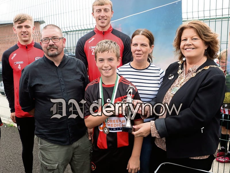 Mayor Patricia Logue presents the Player of the Tournment award to Harrison Murray, Phoenix Athletic in the Padraig Barton Cup. Included are Colm and Aine Barton. Also included are Derry City players, Ciaron Harkin and Sam Todd. (Photos - Tom Heaney, nwpresspics)
