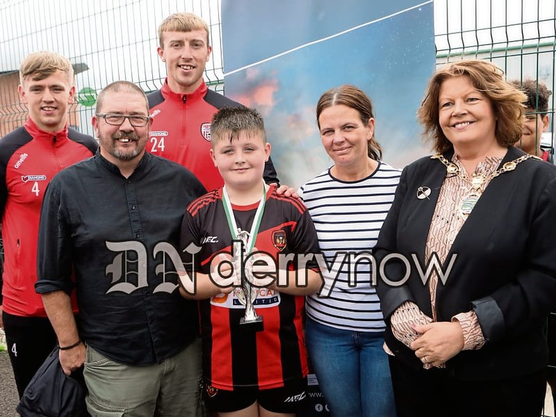 Mayor Patricia Logue who presented the Top Goalscorer of the Tournment award to Aidan McMonagle, Phoenix Athletic in the Padraig Barton Cup. Included are Colm and Aine Barton. Also included are Derry City players, Ciaron Harkin and Sam Todd.