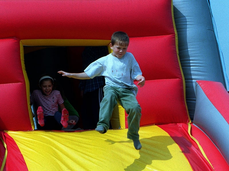 This littler boy makes the most of the ultimate bouncy castle.