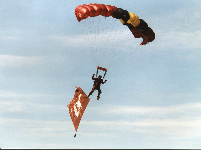 A paraglider drops in to join the fun at Leeds Show/.