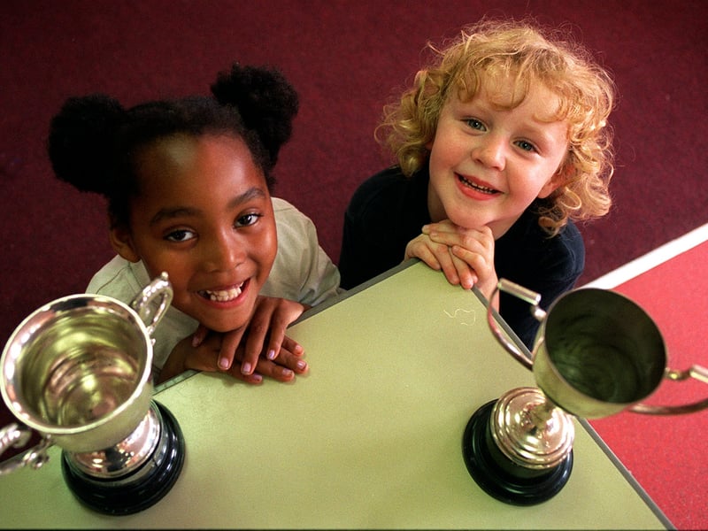 Candice Hutchinson and Philippa Hutchinson from the Choto Moni Childrens Centre in Chapeltown pictured with two of the four trophies  won by kids at Leeds Show.