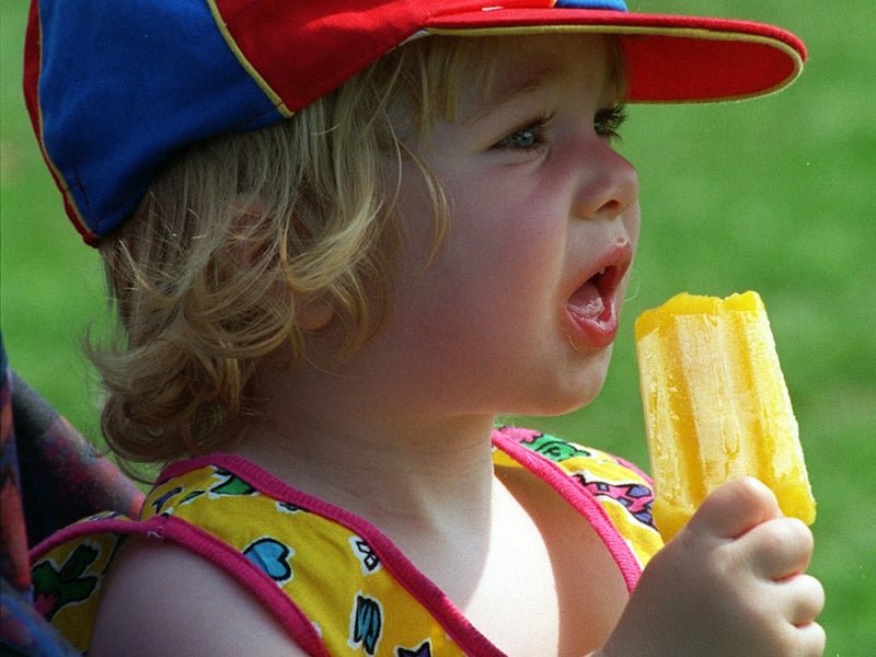 Equipped with sun hat and ice lolly, 20-month-old Charlotte Dibb from Whinmoor keeps her cool.