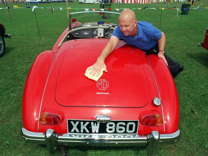 Robert Hirst from Pudsey polishes his 1962 MG A 1600 Mk II at the New Leeds Show.