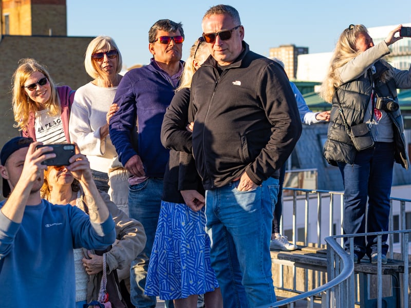 Families watching HMS Prince of Wales on The Round Tower.