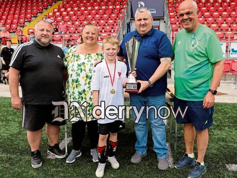 Jim Doherty presents the Aaron Doherty Memorial Cup, in memory of his son who played for Ballymoor FC, to Westport FC captain Theo Bronkal. Included on left is Seanie McLaughlin, Ballymoor FC, and on right Pat Duffy, FAI Youth development officer.