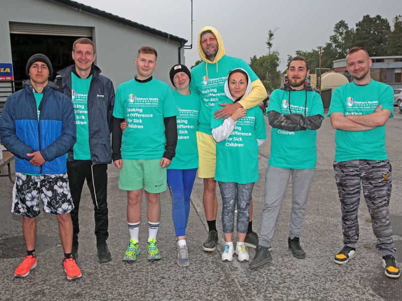 Caption: Dmytra Miliev, Andril Khomenko, Oksana Budzynska, Ivan Budzynskyi, Dolzorolskyi Aostem, Sutheno and Schon Roolchenko and Sezhiii Kostiuchenko at Nally's Spar last Saturday ahead of the start of the Ballymahon Friends of CHI Crumlin Fundraising Run Picture: Shelley Corcoran