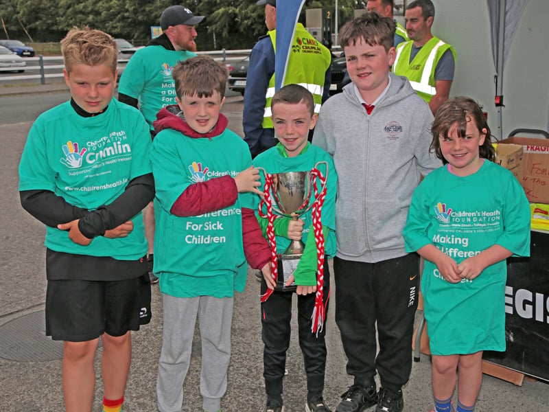 Caption: Grace, Senan and Cian Kelly, Byron O'Connor, and Philip Zajaczkowski with the U10 Cup won by Ballymahon Forgney Community Games pictured at Nally's Spar last Saturday for the Ballymahon Friends of CHI Crumlin Fundraising Run Picture: Shelley Corcoran