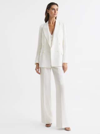 From three-piece numbers to jumpsuits, here’s our pick of the best tailored bridalwear for your big day…