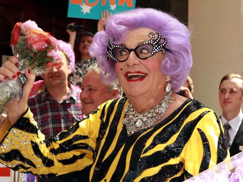 Originally a drab Melbourne housewife satirising Australian suburbia, Dame Edna evolved into an increasingly boisterous and eccentric character, with “wisteria hue” hair and cat-eye glasses.