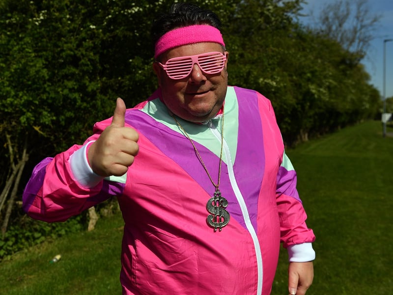 This fan looks resplendent in his all in pink outfit.