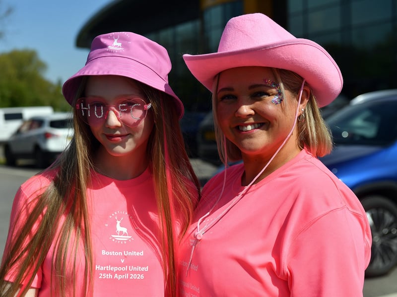 Two Poolies in their pink hats and pink sunglasses.