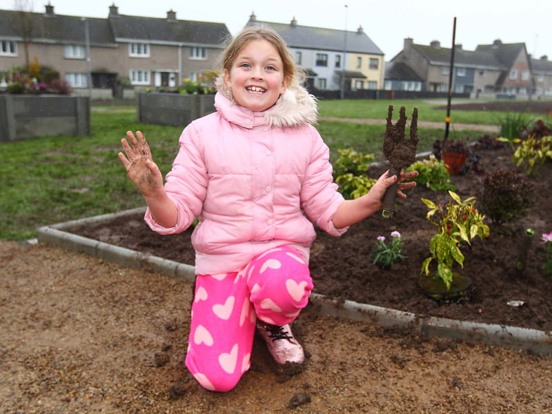 Sophie O'Connell was enjoying the muck as she helped out with the planting at the official opening and blessing of the St.Paul's Jubilee Community Memorial Garden.