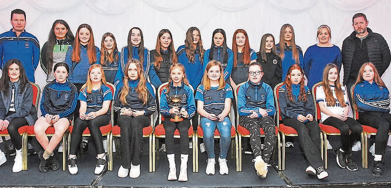 Under 12 girls who won the county championship were presented by Sarah Reynolds. They are pictured with their coaches Niall McKenna, Cathy Reynolds and Frank Barber.