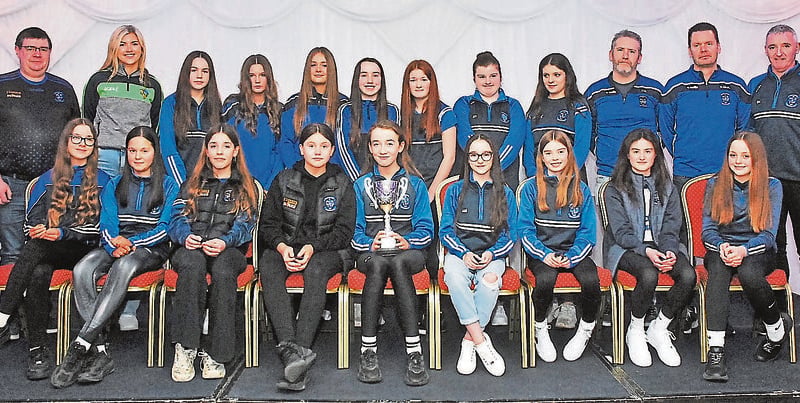 Under 14 girls 11-aside champions were presented with their medals by Jasmine Maye. They are pictured with coaches David Walsh, Niall McKenna and Stephen Morgan and St Mary's LGFA Chairman, John Moran.