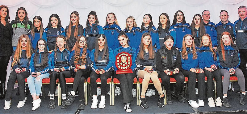 Under 16 Girls 11-aside Shield winners were presented with their medals by Caroline Guckian. They are pictured with coaches Kathy Butler, Ronan Butler, Tom Cronin and Stephen Morgan.