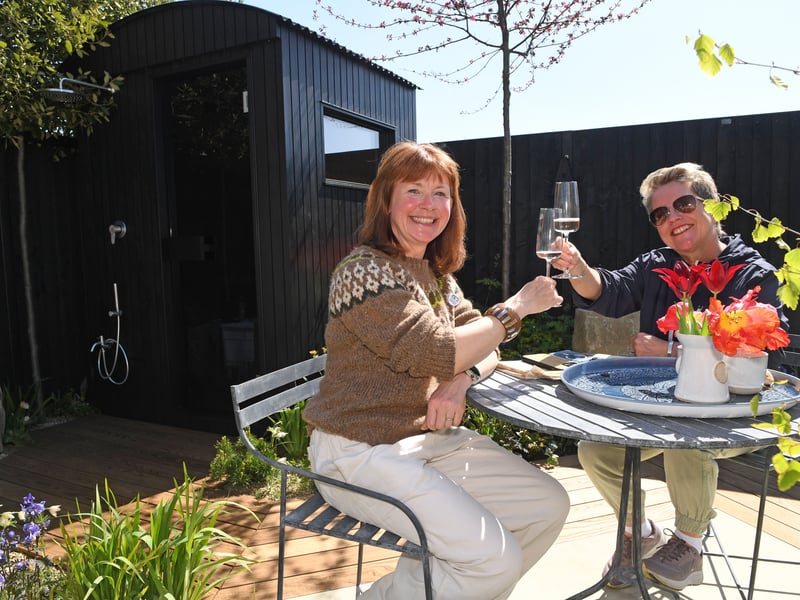Melissa Morton toasts winning best in show for her show garden titled The Breathing Space. 
