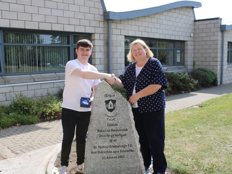 Abbey Community College Principal, Ms Michelle Jefford congratulating student Glen Crowe who received an outstanding 8 H1s in his Leaving Certificate.