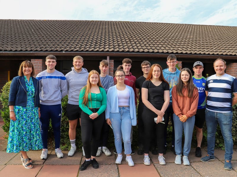 Smiles all around at Coláiste Mhuire Johnstown on Friday morning as Leaving Cert results were collected and celebrated. Pictured back (l-r) were Angela Conroy (Deputy Principal), Billy Garrett, Josh Coady, Daire O’Sullivan, Dylan Foyle, Alex Burke, Gearóid Phelan, Padraig O’Grady and John Dunne (Year head). Back (l-r) Lucy O’Connor, Orlaith Coiley, Kevina Cullen and Aoife Ryan. Photo Christine Tobin