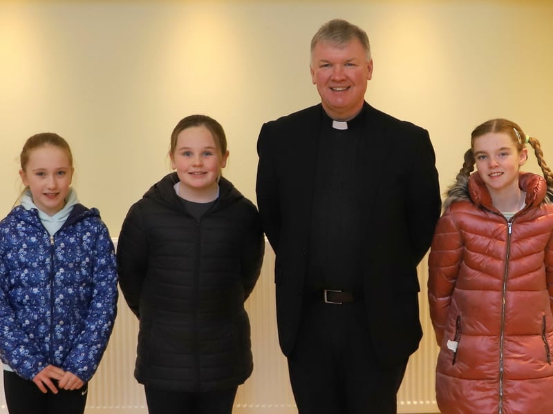 Fr Niall Coll together with the altar servers - Grace Leape, Elsie Browne and Louise Thomas.