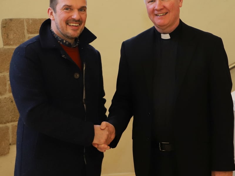 Donegal Town Mayor Pauric Kennedy wishing Fr Niall Coll all the best in his new role.