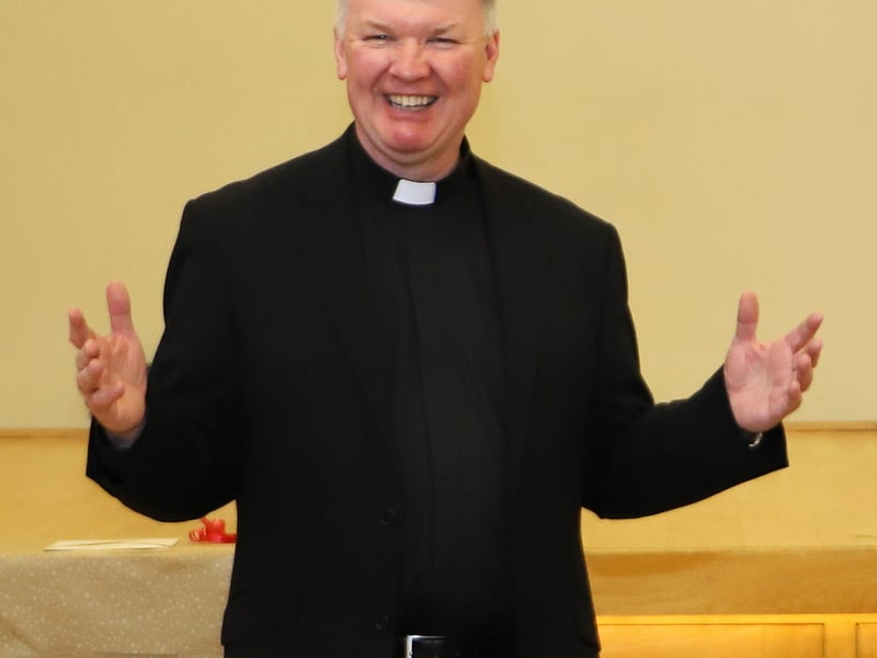 Fr Niall Coll addresses his parishioners in the Parish Centre.