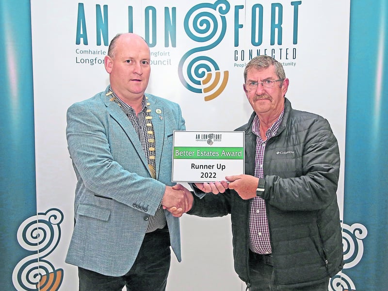 Caption: Cathaoirleach Cllr Turlough McGovern making a presentation to Gerry Linnane, Church View Lanesboro