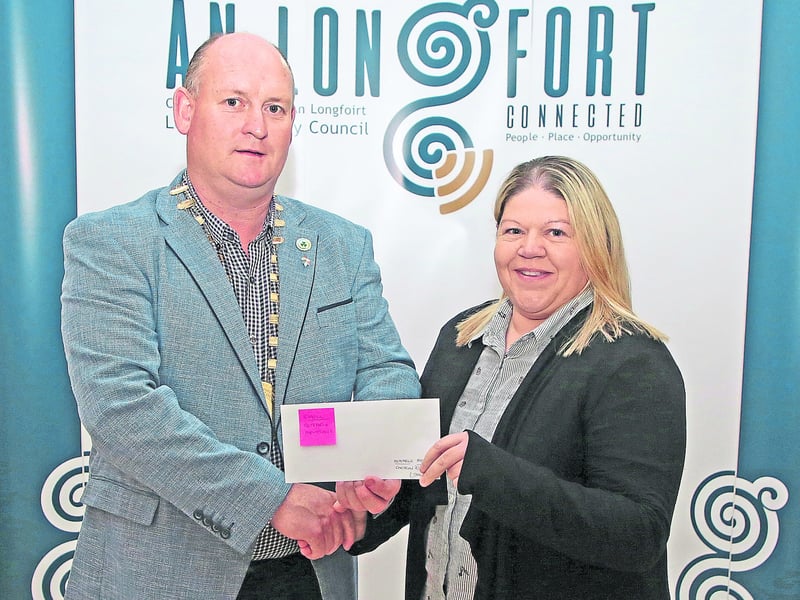 Caption: Longford County Council Cathaoirleach Cllr Turlough McGovern making a presentation to Linda McGarry, Kenagh