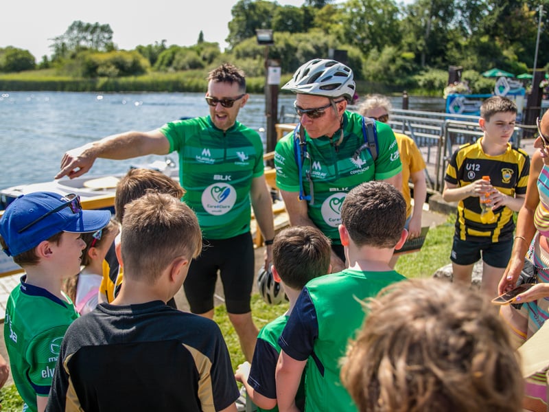 There was huge excitement at the quays in Carrick on Shannon last Saturday afternoon as a large contingent of the Connacht Rugby team and management along with some special guest riders had a stopover at Moon River on their Galway to Sligo Fundraising Cycle #care4claire. For approximately an hour, the cyclists and their support team and met with many of the local young players and signed autographs and jerseys before setting off on the road to Sligo where they finished their 218k trip across the five counties of the province later that evening. Varadkar says IRFU should listen to trans players ‘excluded’ from contact rugby Amongst the large group of cyclists and travelling players were Connacht Head Coach Andy Friend, Ireland playing legends Kieran Marmion and Eric Elwood and former Mayo, Roscommon and Offaly GAA manager John Maughan. The cycle began at The Sportsground in Galway in the early hours of Saturday morning and finished at Sligo RFC. The route took in all five counties with stops in Ballinrobe Co. Mayo, Ballyhaunis Co. Mayo, Frenchpark Co. Roscommon, Carrick-on-Shannon Co. Leitrim, and finally Ross and Claire’s home in Coolaney Co. Sligo, before the final stretch to Sligo RFC. The fundraiser was for 35-year old Sligo native Claire Carpenter who suffered a serious and life-changing event earlier this year. Claire suffered a stroke at her home in Coolaney. 'We don't stand still' on issues of player welfare, World Rugby vows After being rushed to the ICU unit of Beaumont Hospital she was placed in an induced coma for over a week following a life-saving operation. Claire is now thankfully on the road to recovery, however significant funds need to be raised to allow her to continue her rehabilitation in Dun Laoghaire, and eventually lead an independent life at home. Claire’s partner Ross Mannion is a Rugby Participation Officer with Connacht Rugby and was Head Coach of the Connacht Women’s team in 2021. They have three children, Luke (14), Anna (10) and Zach (7).