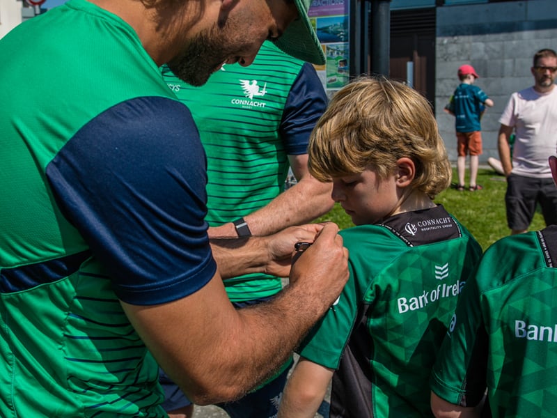 There was huge excitement at the quays in Carrick on Shannon last Saturday afternoon as a large contingent of the Connacht Rugby team and management along with some special guest riders had a stopover at Moon River on their Galway to Sligo Fundraising Cycle #care4claire. For approximately an hour, the cyclists and their support team and met with many of the local young players and signed autographs and jerseys before setting off on the road to Sligo where they finished their 218k trip across the five counties of the province later that evening. Varadkar says IRFU should listen to trans players ‘excluded’ from contact rugby Amongst the large group of cyclists and travelling players were Connacht Head Coach Andy Friend, Ireland playing legends Kieran Marmion and Eric Elwood and former Mayo, Roscommon and Offaly GAA manager John Maughan. The cycle began at The Sportsground in Galway in the early hours of Saturday morning and finished at Sligo RFC. The route took in all five counties with stops in Ballinrobe Co. Mayo, Ballyhaunis Co. Mayo, Frenchpark Co. Roscommon, Carrick-on-Shannon Co. Leitrim, and finally Ross and Claire’s home in Coolaney Co. Sligo, before the final stretch to Sligo RFC. The fundraiser was for 35-year old Sligo native Claire Carpenter who suffered a serious and life-changing event earlier this year. Claire suffered a stroke at her home in Coolaney. 'We don't stand still' on issues of player welfare, World Rugby vows After being rushed to the ICU unit of Beaumont Hospital she was placed in an induced coma for over a week following a life-saving operation. Claire is now thankfully on the road to recovery, however significant funds need to be raised to allow her to continue her rehabilitation in Dun Laoghaire, and eventually lead an independent life at home. Claire’s partner Ross Mannion is a Rugby Participation Officer with Connacht Rugby and was Head Coach of the Connacht Women’s team in 2021. They have three children, Luke (14), Anna (10) and Zach (7).