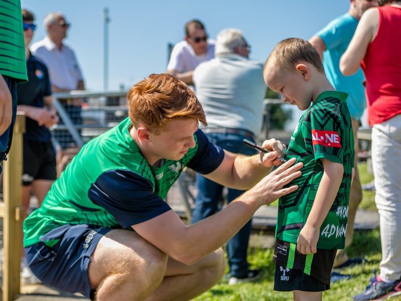 There was huge excitement at the quays in Carrick on Shannon last Saturday afternoon as a large contingent of the Connacht Rugby team and management along with some special guest riders had a stopover at Moon River on their Galway to Sligo Fundraising Cycle #care4claire. For approximately an hour, the cyclists and their support team and met with many of the local young players and signed autographs and jerseys before setting off on the road to Sligo where they finished their 218k trip across the five counties of the province later that evening. Varadkar says IRFU should listen to trans players ‘excluded’ from contact rugby Amongst the large group of cyclists and travelling players were Connacht Head Coach Andy Friend, Ireland playing legends Kieran Marmion and Eric Elwood and former Mayo, Roscommon and Offaly GAA manager John Maughan. The cycle began at The Sportsground in Galway in the early hours of Saturday morning and finished at Sligo RFC. The route took in all five counties with stops in Ballinrobe Co. Mayo, Ballyhaunis Co. Mayo, Frenchpark Co. Roscommon, Carrick-on-Shannon Co. Leitrim, and finally Ross and Claire’s home in Coolaney Co. Sligo, before the final stretch to Sligo RFC. The fundraiser was for 35-year old Sligo native Claire Carpenter who suffered a serious and life-changing event earlier this year. Claire suffered a stroke at her home in Coolaney. 'We don't stand still' on issues of player welfare, World Rugby vows After being rushed to the ICU unit of Beaumont Hospital she was placed in an induced coma for over a week following a life-saving operation. Claire is now thankfully on the road to recovery, however significant funds need to be raised to allow her to continue her rehabilitation in Dun Laoghaire, and eventually lead an independent life at home. Claire’s partner Ross Mannion is a Rugby Participation Officer with Connacht Rugby and was Head Coach of the Connacht Women’s team in 2021. They have three children, Luke (14), Anna (10) and Zach (7).
