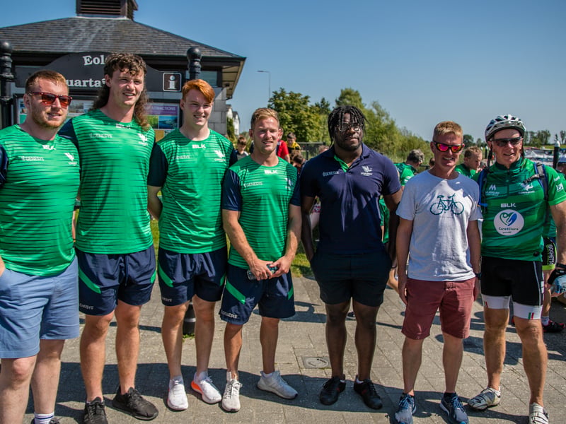 There was huge excitement at the quays in Carrick on Shannon last Saturday afternoon as a large contingent of the Connacht Rugby team and management along with some special guest riders had a stopover at Moon River on their Galway to Sligo Fundraising Cycle #care4claire. For approximately an hour, the cyclists and their support team and met with many of the local young players and signed autographs and jerseys before setting off on the road to Sligo where they finished their 218k trip across the five counties of the province later that evening. Varadkar says IRFU should listen to trans players ‘excluded’ from contact rugby Amongst the large group of cyclists and travelling players were Connacht Head Coach Andy Friend, Ireland playing legends Kieran Marmion and Eric Elwood and former Mayo, Roscommon and Offaly GAA manager John Maughan. The cycle began at The Sportsground in Galway in the early hours of Saturday morning and finished at Sligo RFC. The route took in all five counties with stops in Ballinrobe Co. Mayo, Ballyhaunis Co. Mayo, Frenchpark Co. Roscommon, Carrick-on-Shannon Co. Leitrim, and finally Ross and Claire’s home in Coolaney Co. Sligo, before the final stretch to Sligo RFC. The fundraiser was for 35-year old Sligo native Claire Carpenter who suffered a serious and life-changing event earlier this year. Claire suffered a stroke at her home in Coolaney. 'We don't stand still' on issues of player welfare, World Rugby vows After being rushed to the ICU unit of Beaumont Hospital she was placed in an induced coma for over a week following a life-saving operation. Claire is now thankfully on the road to recovery, however significant funds need to be raised to allow her to continue her rehabilitation in Dun Laoghaire, and eventually lead an independent life at home. Claire’s partner Ross Mannion is a Rugby Participation Officer with Connacht Rugby and was Head Coach of the Connacht Women’s team in 2021. They have three children, Luke (14), Anna (10) and Zach (7).