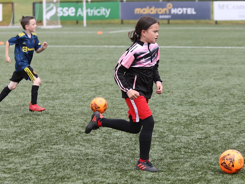 Ashley Doherty pushes forward with the ball.