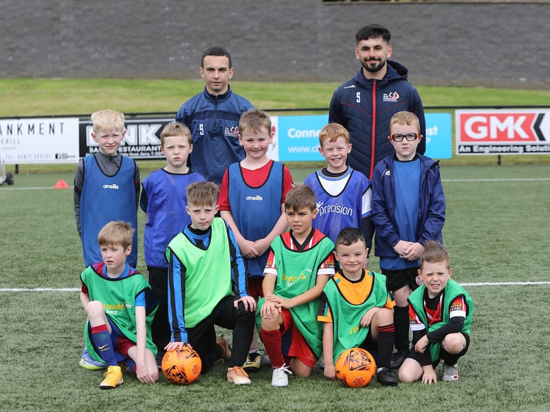 The 8 year olds with coaches Paul O'Donnell and Matthew Kirk.