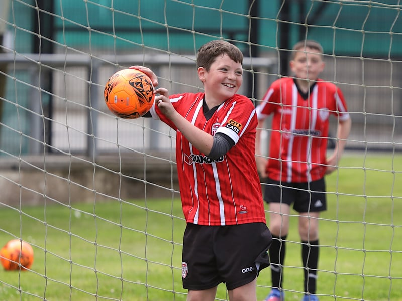 A big smile from goalkeeper Alfie Kelly as he catches this incoming ball. 