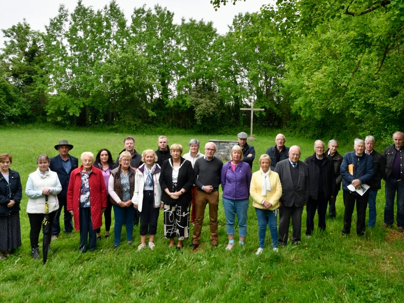 The gathering attending the commemoration stood before the altar and cross at the Callan Famine GraveyardPICTURE: HARRY REID Click 'NEXT' for more pictures