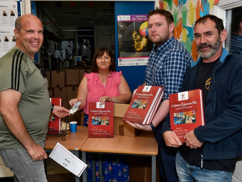 ABOVE: Buying copies of the History of Collaiste Eamann Rís from Catriona Roche were Tommy Stuart, Eoin Ryan and Neil Sinnott.PICTURE: HARRY REID