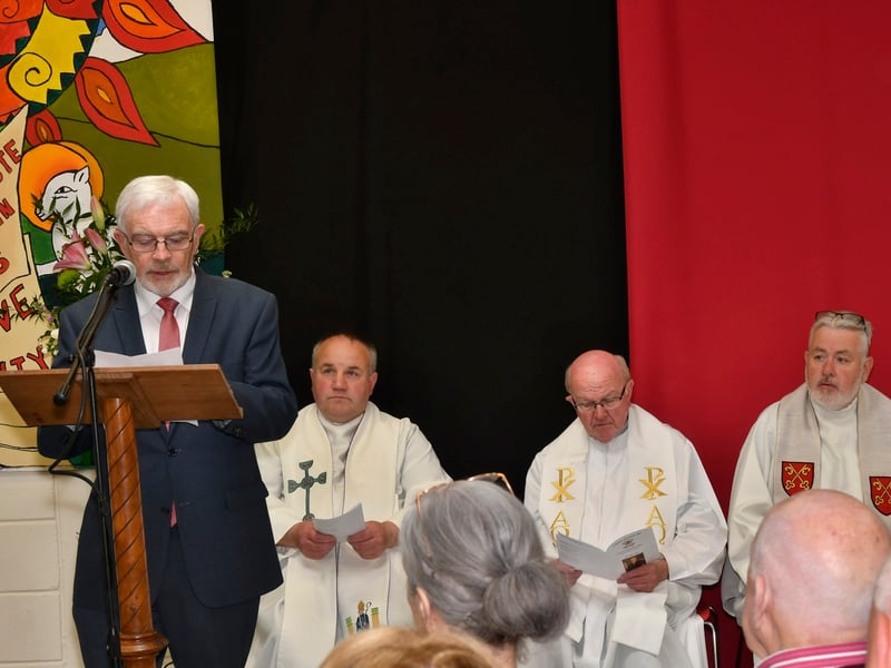 ABOVE: Launching the 400-page, hardback history of Coláiste Eamann Rís were past pupil and RTE Doc on One's Dr. Joe Kearney with teacher and editor of the tome Martina Griffin. PICTURE: HARRY REID The beautiful heat from the sun only served to add to the warmth of the atmosphere last Sunday as crowds packed into the assembly hall at Coláiste Éamann Rís for their school celebration mass and closure event.   The many locals with strong connections to the school remarked how incredible the school looked, bedecked as it was with fragrant floral displays, lanterns with the school candle brightly lit and a myriad of colourful photographs and flags representing the diverse ethnicities of the students on display.   Chairperson of the board of Management of Coláiste Éamann Rís, Martin Fahey began the festivities when he outlined the schedule for the day. The moving ceremony was officiated by past pupil Fr Richard Scriven, who spoke fondly of his time at Coláiste Éamann Rís, and the strong ongoing family link which has continued through the next generation. The parishes of Kilmanagh, Mullinahone and St Patrick’s were represented by the concelebrants, Fr. Liam Taylor, Fr. Danny O’Gorman and former pupil Fr. Peter Muldowney. A hugely symbolic ceremony of light was performed by Sr Maria representing the Mercy Sisters, Br. Christy Carroll of the Christian Brothers from Westcourt and Mr. Anthony Leahy, Principal of Coláiste Abhainn Rí. The congregation were reminded of the importance of preserving the ethos of both schools as the begin the new journey together in Coláiste Abhainn Rí. Fr Scriven stressed the value of looking after each other and the need to find a common ground when differences arise, as they may. He encapsulated it best when he referred to the forthcoming amalgamation as “a pilgrimage rather than a sun holiday”.   ABOVE: Martin Fahey, Chairman of the Board of Management. PICTURE: HARRY REID The singing of the Callan Church choir, past pupil Thomas O’Callaghan and the
