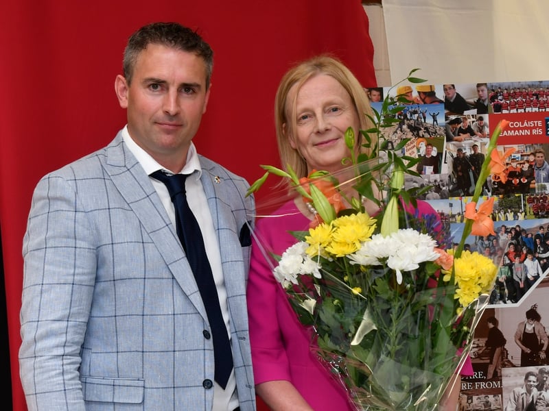ABOVE: Launching the 400-page, hardback history of Coláiste Eamann Rís were past pupil and RTE Doc on One's Dr. Joe Kearney with teacher and editor of the tome Martina Griffin. PICTURE: HARRY REID The beautiful heat from the sun only served to add to the warmth of the atmosphere last Sunday as crowds packed into the assembly hall at Coláiste Éamann Rís for their school celebration mass and closure event.   The many locals with strong connections to the school remarked how incredible the school looked, bedecked as it was with fragrant floral displays, lanterns with the school candle brightly lit and a myriad of colourful photographs and flags representing the diverse ethnicities of the students on display.   Chairperson of the board of Management of Coláiste Éamann Rís, Martin Fahey began the festivities when he outlined the schedule for the day. The moving ceremony was officiated by past pupil Fr Richard Scriven, who spoke fondly of his time at Coláiste Éamann Rís, and the strong ongoing family link which has continued through the next generation. The parishes of Kilmanagh, Mullinahone and St Patrick’s were represented by the concelebrants, Fr. Liam Taylor, Fr. Danny O’Gorman and former pupil Fr. Peter Muldowney. A hugely symbolic ceremony of light was performed by Sr Maria representing the Mercy Sisters, Br. Christy Carroll of the Christian Brothers from Westcourt and Mr. Anthony Leahy, Principal of Coláiste Abhainn Rí. The congregation were reminded of the importance of preserving the ethos of both schools as the begin the new journey together in Coláiste Abhainn Rí. Fr Scriven stressed the value of looking after each other and the need to find a common ground when differences arise, as they may. He encapsulated it best when he referred to the forthcoming amalgamation as “a pilgrimage rather than a sun holiday”.   ABOVE: Martin Fahey, Chairman of the Board of Management. PICTURE: HARRY REID The singing of the Callan Church choir, past pupil Thomas O’Callaghan and the