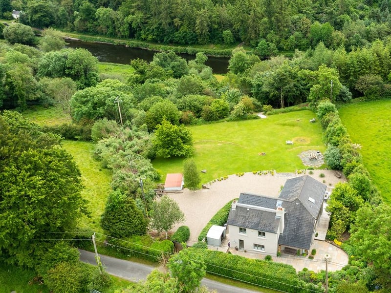 Clarahawn House, Graiguenamanagh, Co. Kilkenny, R95 YA25 4 beds - 3 baths - 184m2 ASKING PRICE: €595,000 TAP 'NEXT>' ABOVE FOR NEXT PIC Clarahawn House is situated on the outskirts of the charming market village that is Graiguenamanagh. Located on the meandering River Barrow, the town is rich with history and is considered to be one of the most beautiful areas in the sunny south east of Ireland. The townland name translates in Irish to Gráig na Manach, meaning "Village of the Monks". Graiguenamanagh is home to Duiske Abbey which was the largest Cistercian Abbey in Ireland. With its remarkable combination of mountain views, lush rolling hills, forest and river valleys, Graiguenamanagh offers nature lovers a plentiful feast as well as countless amenities for those keen on outdoor activities. It also has all the day to day amenities: two supermarkets, a Post Office, pharmacies, public houses, restaurants, café and the Cushendale Woollen Mill A 20 minutes drive from Clarahawn House will take you to Thomastown. This lively market town is home to a plethora of pubs, restaurants, cafes and notable points of interest such as Jerpoint Abbey, Kilfane Glen Gardens, and the world-renowned Mount Juliet Golf Course. Set on the western bank of the River Barrow, Clarahawn House is a divine residence positioned within a private oasis of approximately 1.06 ha (2.61 acres). The house enjoys serenity inducing views over the private landscape rolling down to the banks of the Barrow. Clarahawn House is a bright, but cosy waterfront home with sole access to the River Barrow. The residence is well-designed with 4 bedrooms including a superb master suite. There are wonderful reception and entertaining rooms, as well as spaces to work and relax. It is the perfect setting to make it your retreat from the city or your year-round home. This truly wonderful house is bathed in daylight, filling the home with warm hues. The kitchen opens up onto wooden decking, inviting you to have a morning coffee or perhaps a late lunch
