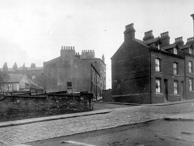 On the left, perimeter wall around reservoir, Stanley Road continues towards the right, terrace houses with dormer windows to attic floors. Extreme right is the end of Raby Place and cleared ground where houses have been demolished. In the centre is Buslingthorpe View. Pictured in April 1930.