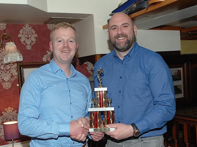 Ultan McElroy, referee for the Minor final replay receiving his award from Anthony Brisco.