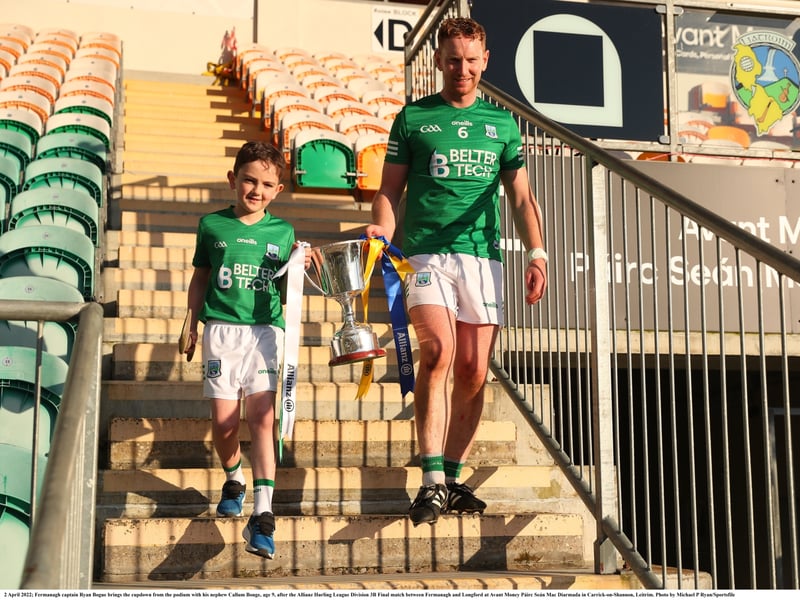 Caption: Fermanagh captain Ryan Bogue brings the cup down from the podium with his nephew Callum Bouge, age 9, after the Allianz Hurling League Division 3B Final Photo by Michael P Ryan/Sportsfile