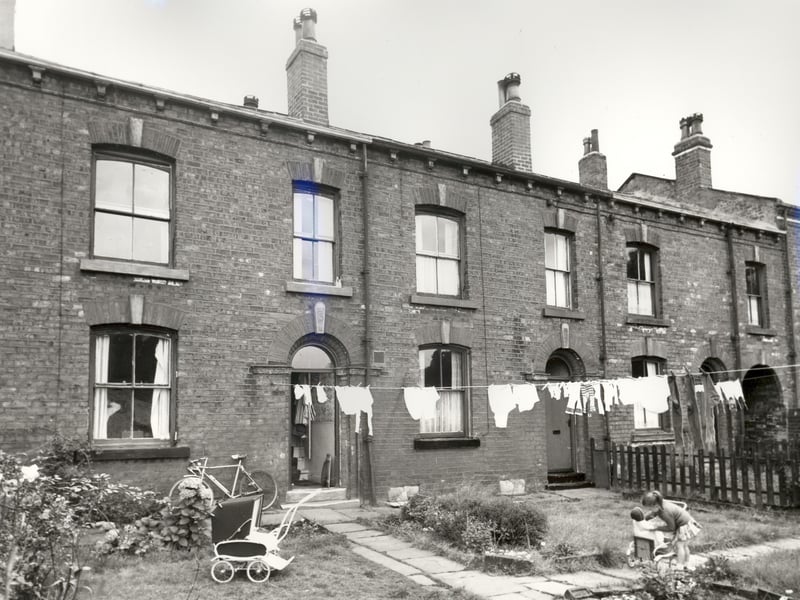 Three back-to-back properties on Parsonage View pictured in August 1966. These gardens backed onto allotments with passageways such as the one on the right edge giving access to Main Street.
