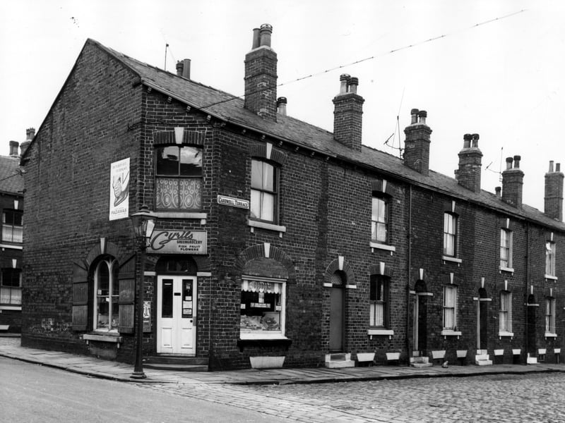 On the left of this view is Cyril's greengrocery, which also sells fish, fruit and flowers. This was number 10 Main Road. Cardwell Street runs to the right edge, numbers 3 to 9 are in view. These houses awaited demolition in line with the citywide slum clearance programme. Pictured in August 1966.
