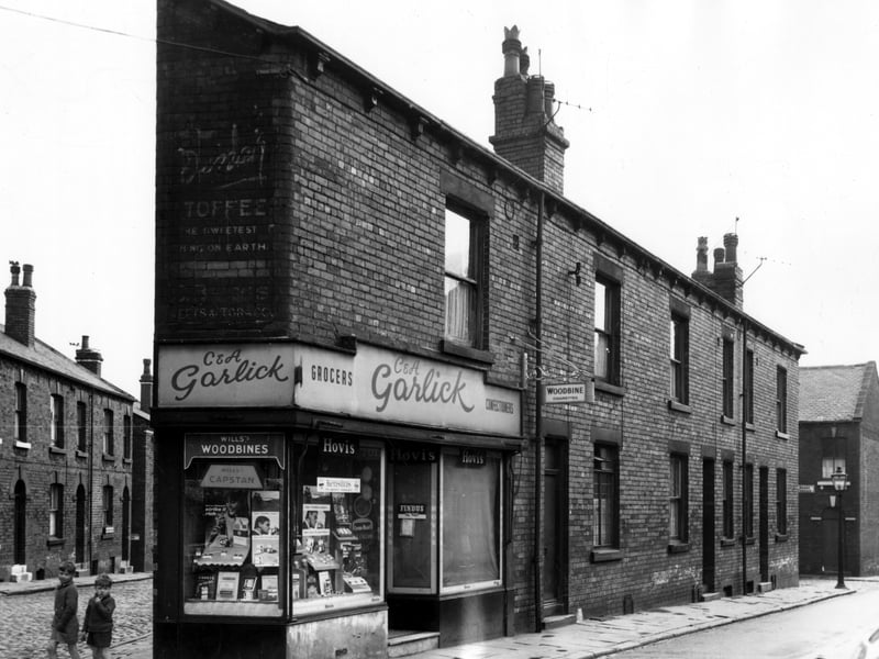 Two boys stand next to a grocers and confectioners on Main Road in August 1966. Bright Terrace can seen in the background.
