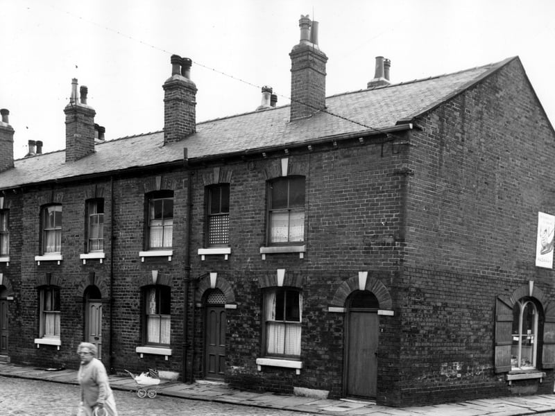 The even numbered side of Lowe Street runs from the left edge of this view to number 2 on the right. These were back-to-back properties. On the right edge the shop window of Cyril's Greengrocers can be seen at number 10 Main Road. Pictured in  August 1966.