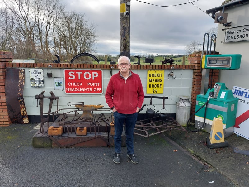 Pat Kelly beside a set of Blacksmith's tools 