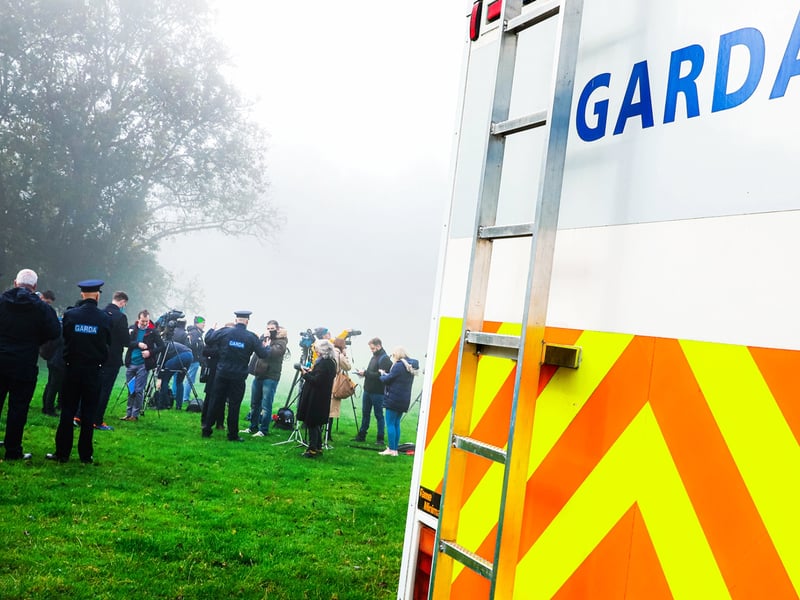 Members of the media gathered at the site on Monday morning